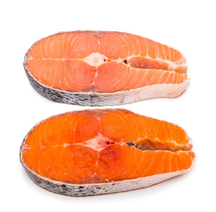 A comparison between farmed (top) and wild (bottom) salmon.