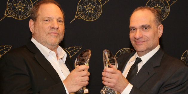 Harvey and Bob Weinstein pose with the Motion Picture Showmanship Award backstage at The Beverly Hilton hotel on Feb. 20, 2015.