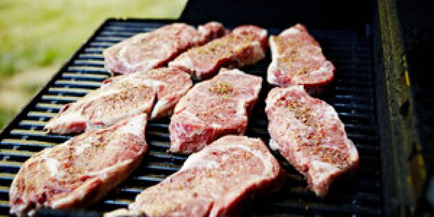 Steaks grilling on barbecue