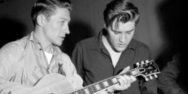LOS ANGELES - JUNE 4: Elvis Presley and Scotty Moore rehearse for their appearance on the Milton Berle Show at the NBC Burbank studios on June 4 1956 in Los Angeles California. (Photo by Michael Ochs Archives/Getty Images)
