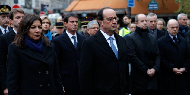 French President Francois Hollande and Paris Mayor Anne Hidalgo unveil a commemorative plaque next to the A La Bonne Biere cafe in Paris.