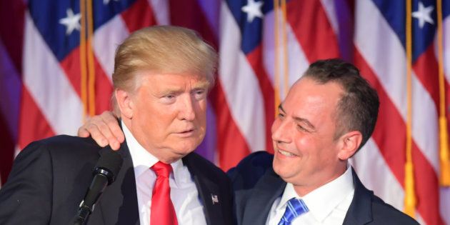 Chairman of the Republican National Committee (RNC) Reince Priebus (R) hugs Republican presidential elect Donald Trump during election night at the New York Hilton Midtown in New York on November 9, 2016. / AFP / JIM WATSON (Photo credit should read JIM WATSON/AFP/Getty Images)
