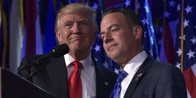 Chairman of the Republican National Committee (RNC) Reince Priebus (R) hugs Republican presidential elect Donald Trump during election night event at the New York Hilton Midtown in New York on November 9, 2016. / AFP / MANDEL NGAN (Photo credit should read MANDEL NGAN/AFP/Getty Images)