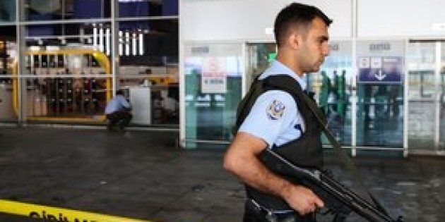 A Turkish police officer stands guard at Istanbul Ataturk Airport after air traffic returned to normal following the triple suicide bombing that killed 44 people on June 29.