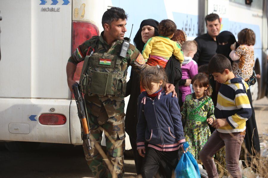 Iraqis on their way to Khazir refugee camp after fleeing from clashes in Mosul.