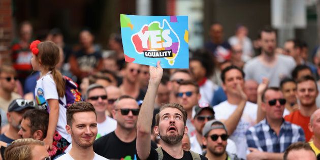 People display their support at a Marriage Equality rally in Sydney's Taylor Square