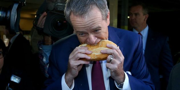 Bill Shorten tucks into a sausage from the... middle?