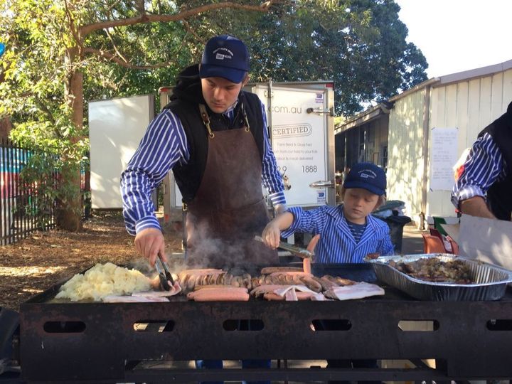 Jack and Charlie hold the fort at the Double Bay Public School sausage sizzle.