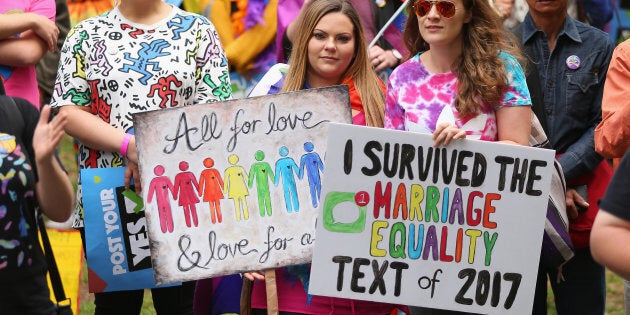 People show their support at the YES March for Marriage Equality on October 21, 2017 in Sydney,