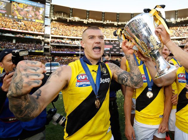 Dustin Martin of the Tigers celebrates with the Premiership Cup during the 2017 Toyota AFL Grand Final match between the Adelaide Crows and the Richmond Tigers.