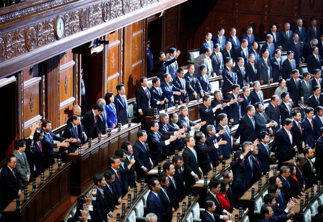 Lawmakers raise their hands and shouts "banzai" (cheers) after the dissolution of lower house.