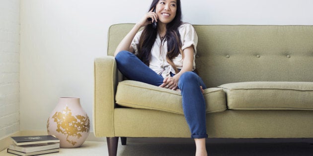 Woman sitting on sofa