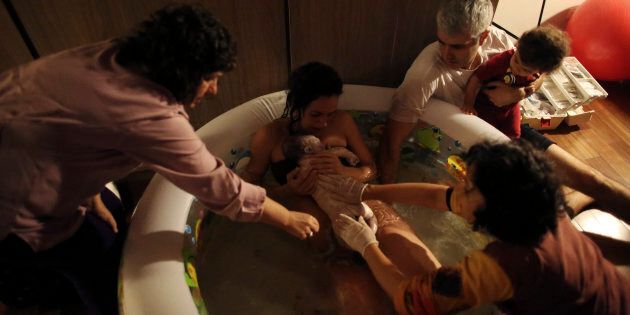 Mother Manuela Mitre gives birth to second child Gael while lying in a pool of water, at her home in Sao Paulo, Brazile.