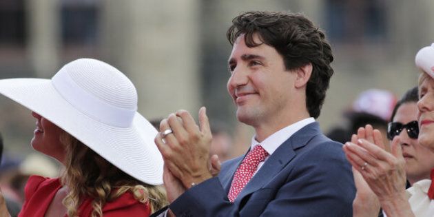 Justin Trudeau, Canada's prime minister, right, and wife Sophie Gregoire Trudeau, left, applaud during Canada Day performances.