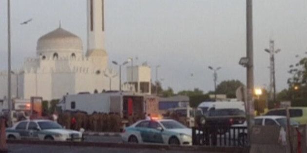 General view of security personnel in front of a mosque as police stage a second controlled explosion near the U.S. consulate in Jeddah, Saudi Arabia.