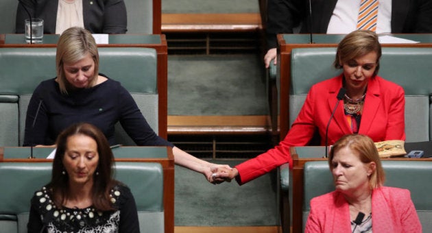 Labor MPs Susan Lamb and Anna Aly listen as OL Shorten marks the death of Linda Burney's son.