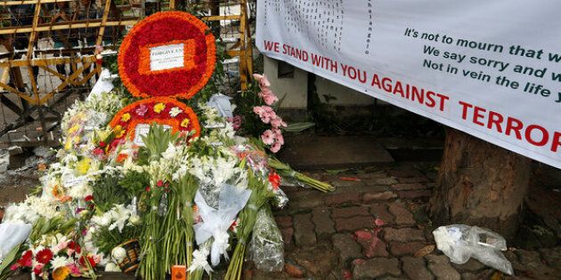 Wreaths and flowers, offered by people to pay tribute to the victims of the attack on the Holey Artisan Bakery and the O'Kitchen Restaurant, are pictured at a makeshift memorial near the attack site, in Dhaka, Bangladesh, July 5, 2016. REUTERS/Adnan Abidi