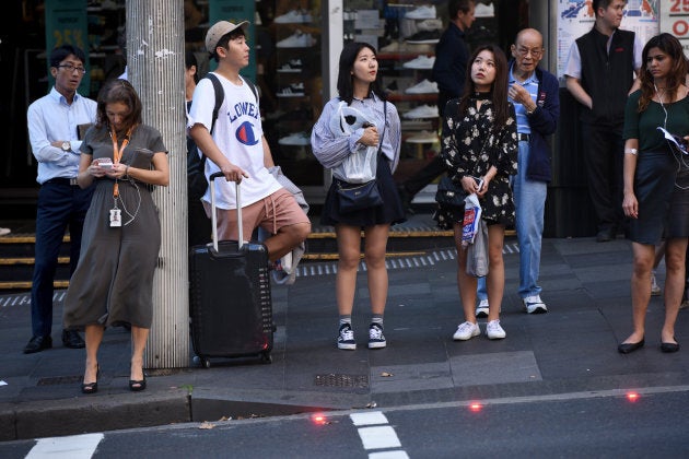 New lights have been installed in the road and footpath so that people distracted by their phones (i.e. the woman on the left) know not to walk.