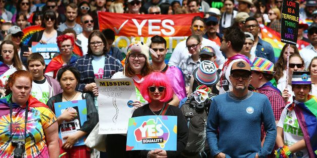 Protesters look on during the yes March for Marriage Equality on October 21, 2017 in Sydney, Australia.