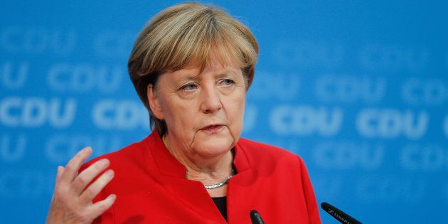German Chancellor Angela Merkel addresses a news conference, to announce that she will run again for the Chancellorship.