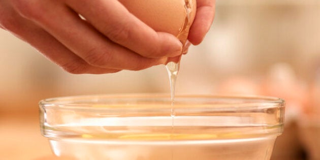 Woman cracking egg