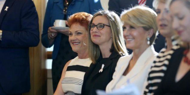 Julie Inman Grant between Pauline Hanson and foreign minister Julie Bishop