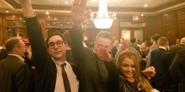 Tila Tequila poses with two others while performing the Nazi salute.