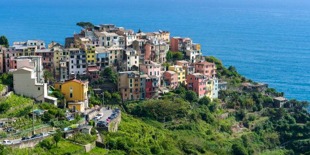 The colorful houses of Corniglia town, part of Cinque Terre, are crammed on a hill on the cost of the Mediterranean Sea.