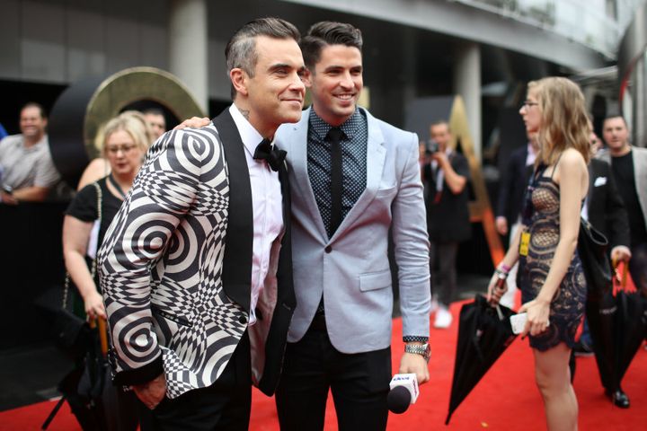 Robbie Williams arrives.