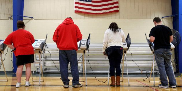 Voters cast their votes during the U.S. presidential election in Elyria, Ohio, U.S. November 8, 2016. REUTERS/Aaron Josefczyk/File Photo