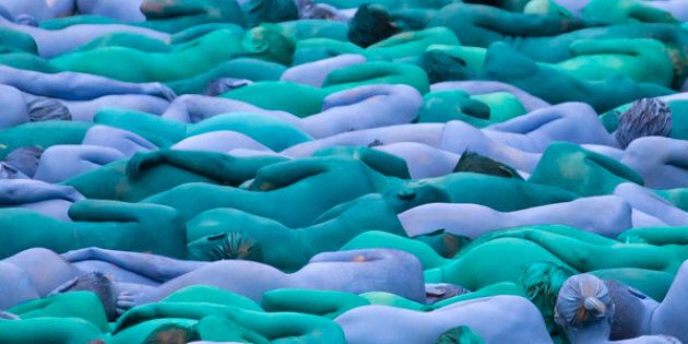 Naked volunteers, painted in blue to reflect the colors found in Marine paintings in Hull's Ferens Art Gallery, participating in artist Spencer Tunick's