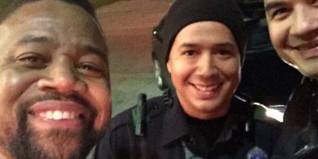 Actor Cuba Gooding Jr. is seen posing for a photo with Dallas police officer Patrick Zamarripa and his partner back in February.