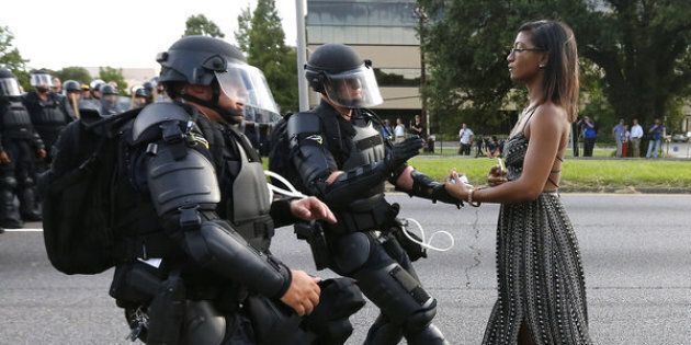 A woman's peaceful act of resistance during a protest in Baton Rouge, Louisiana, has become the symbol of a powerful moment in the Black Lives Matter movement.