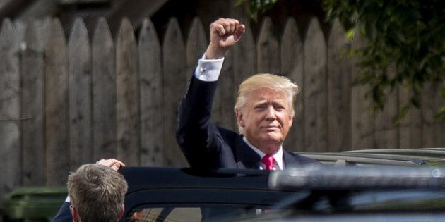 Donald Trump, presumptive Republican presidential nominee, gestures while leaving a meeting with House Republicans at the Capitol Hill Club in Washington, D.C., U.S., on Thursday, July 7, 2016. House Republicans met with Trump on Thursday and many came away saying he can unify their party for the November election, though some members stayed away from the high-profile summit. Photographer: Pete Marovich/Bloomberg via Getty Images