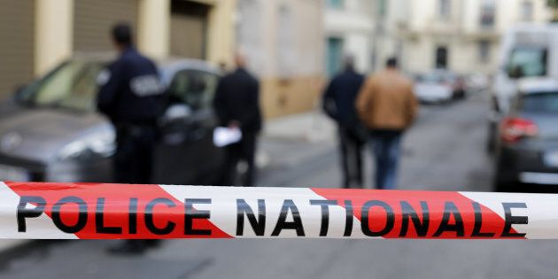 Police are searching for an armed suspect after finding a dead woman in a retirement home in France. Pictured here, police tape blocks off an area in France on Oct. 24, 2016.