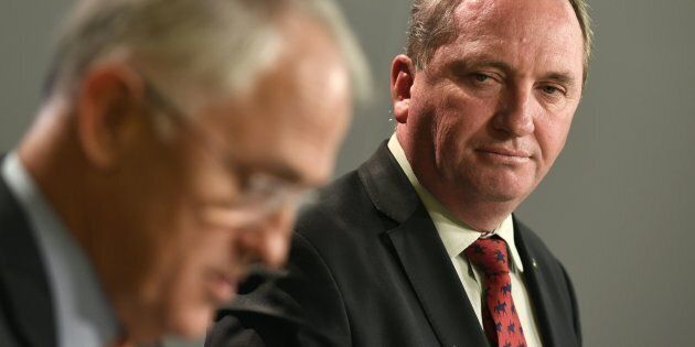 Australia's Deputy Prime Minister Barnaby Joyce (R) looks at Prime Minister Malcolm Turnbull (L) addressing a press conference in after Turnbull rejected calls for him to resign after the disastrous 2016 election.