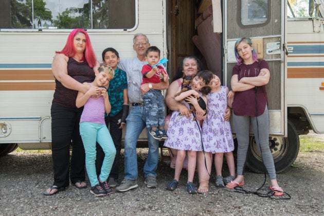 Tatiana and Krista Hogan pose for a photo with family.