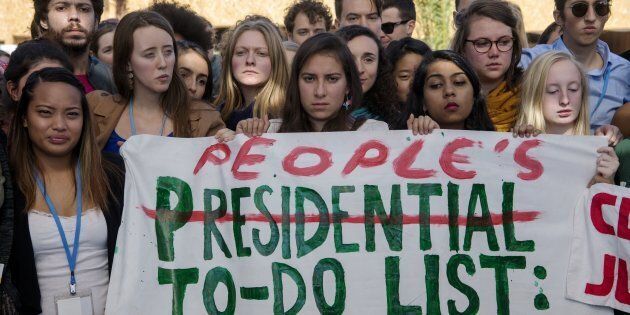 American students protest outside the UN climate talks during the COP22 international climate conference in Marrakesh in reaction to Donald Trump's victory in the US presidential election, on November 9, 2016.