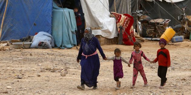 Rebels and a senior Western diplomat said Russian jets hit the Hadalat area near Syria's border with Jordan where hundreds of refugees are sheltering, pictured above in May.