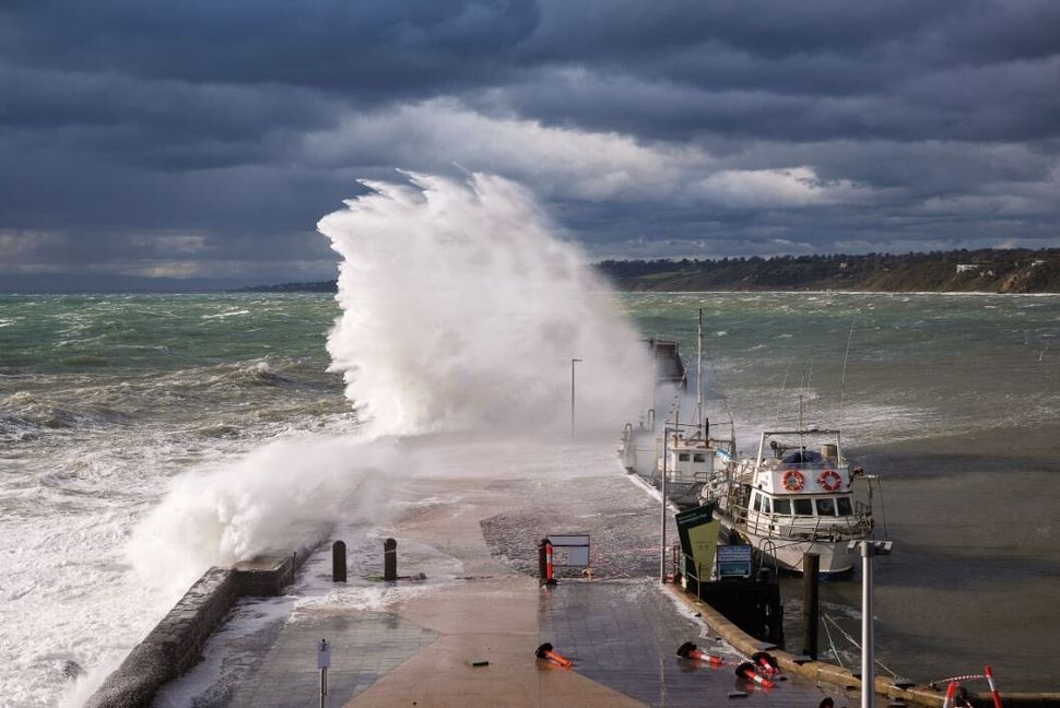 This image of a wave crashing over Mornington Pier in Port Phillip Bay was taken while a strong cold front roared across the bay and southern Victoria.