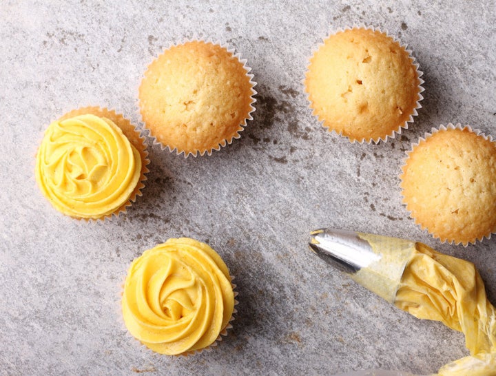 Finish your cupcake with buttercup rose frosting.