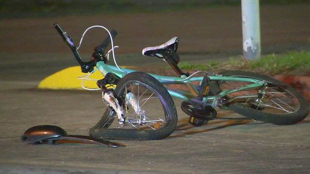The girl's crumpled bicycle at the scene of the crash.