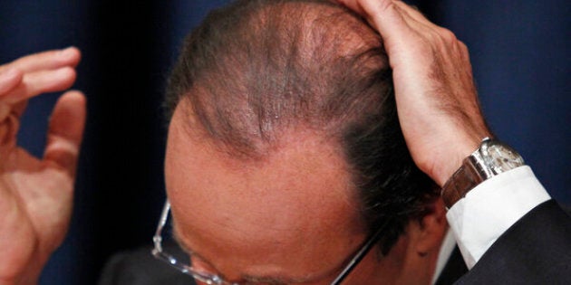 France's President Francois Hollande smoothes down his hair during a news conference following his speech at the 67th United Nations General Assembly at the U.N. headquarters in New York September 25, 2012. REUTERS/Eduardo Munoz (UNITED STATES - Tags: POLITICS)