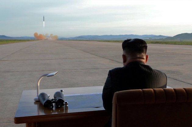 North Korean leader Kim Jong Un watches the launch of a Hwasong-12 missile in this undated photo released by North Korea's Korean Central News Agency.