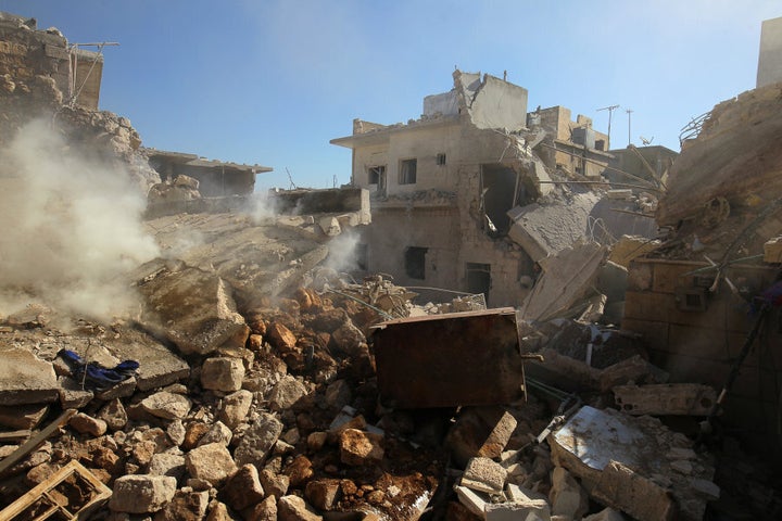 Smoke rises from damaged buildings after an airstrike on the rebel-held town of Darat Izza, province of Aleppo on November 5, 2016.