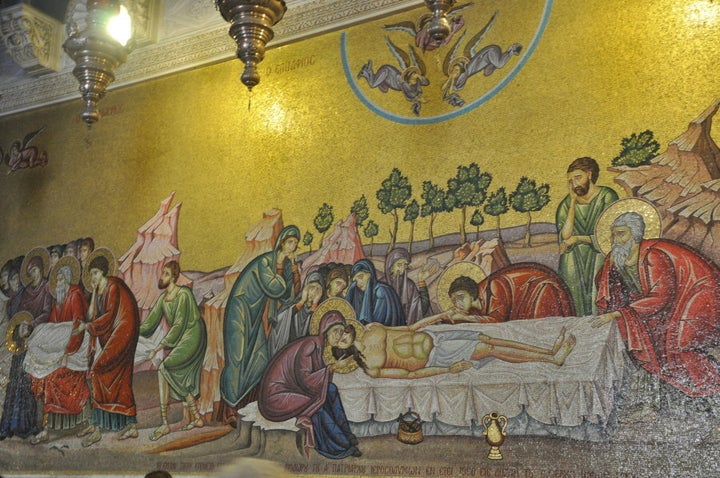 A Mosaic depicting the body of Jesus inside the entrance of the Church