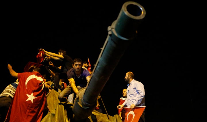 People surround a Turkish army tank in Ankara.