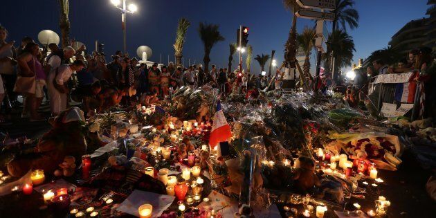 Crowds gather at a make-shift memorial for victims of the deadly Bastille Day attack on the Promenade des Anglais in Nice on July 16, 2016.The Islamic State group claimed responsibility for the truck attack that killed 84 people in Nice on France's national holiday, a news service affiliated with the jihadists said on July 16. Tunisian Mohamed Lahouaiej-Bouhlel, 31, smashed a 19-tonne truck into a packed crowd of people in the Riviera city celebrating Bastille Day -- France's national day. / AFP / Valery HACHE (Photo credit should read VALERY HACHE/AFP/Getty Images)