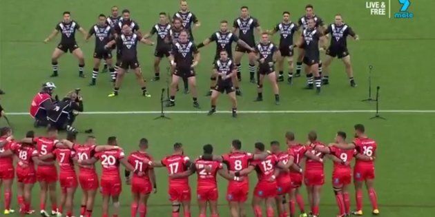Tonga stares down New Zealand as they perform the Haka.