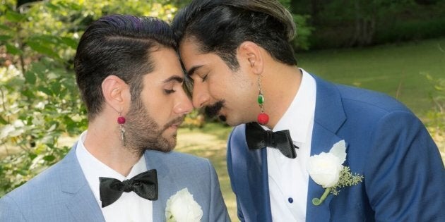 Nima Nia (left) and Ramin Haghjoo pose for a portrait at their August wedding.